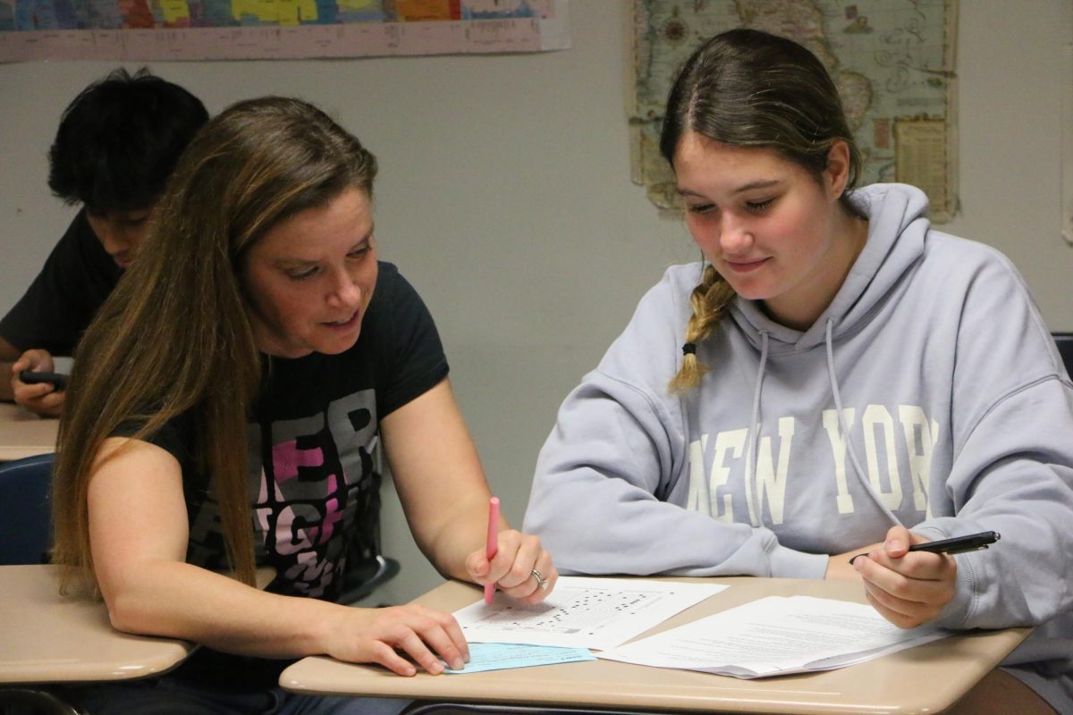 AP European History teacher Jennifer Ellery mentors a student as she studies for an upcoming exam. Jennifer Ellery was awarded most influential teacher from the 2023-2024 school year.