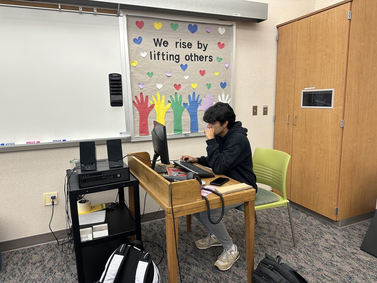 Maanav Rajesh, senior and CSHS president, begins preparation for the meeting presentation on Oct.14. CSHS will meet on the second Monday of every month in media center classrooms two and three.