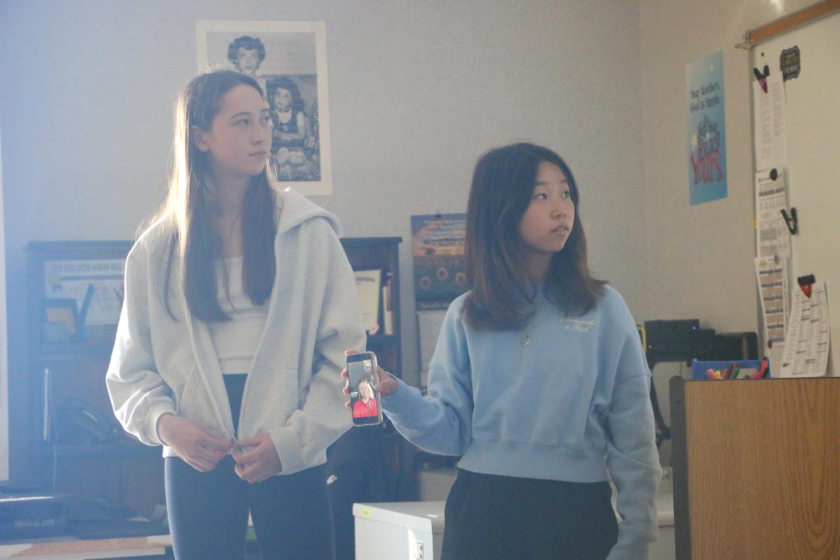 Irene Hwang (right), A Kid Again officer and sophomore, sets up a Zoom call with a guest speaker on Oct. 3, 2024. "A Kid Again is a club that provides fun adventures for children with life-threatening conditions," Hwang said. 