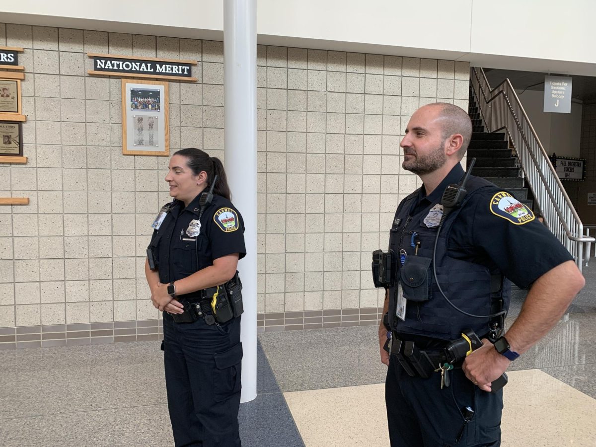 SROs Blake Lytle and Ashley Williams monitor the commons during the day on Oct. 15. Lytle said, “We’re always evaluating our entry points, and getting ideas of concerns from our students.”