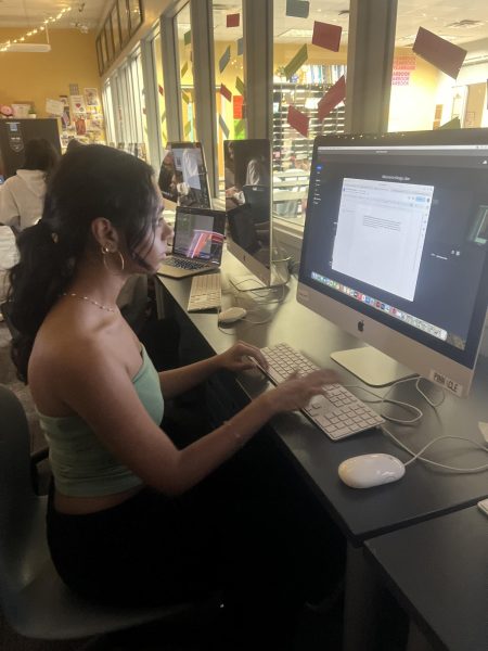 Avika Rajmane, Pinnacle staff member and sophomore, works on her computer during SSRT. She said, “I love being on staff because it's super fun to be a part of the community and help make spreads.”