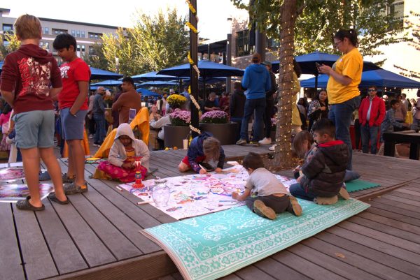 Kids draw and participate in Diwali activities at the Diwali party held at Midtown on Oct. 26. Arya said the experience was really fun and allowed her to connect with her culture better.  