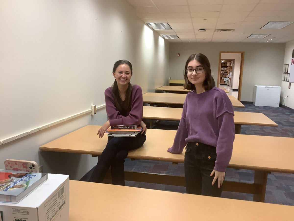 FCCLA state officers Laynie Wade (left) and Sophia Pavlakos (right) film a promotional video for their winter book drive in B175 on Nov. 19. Wade said, “We're planning to have flyers around the FCS classrooms to promote the book drive.”