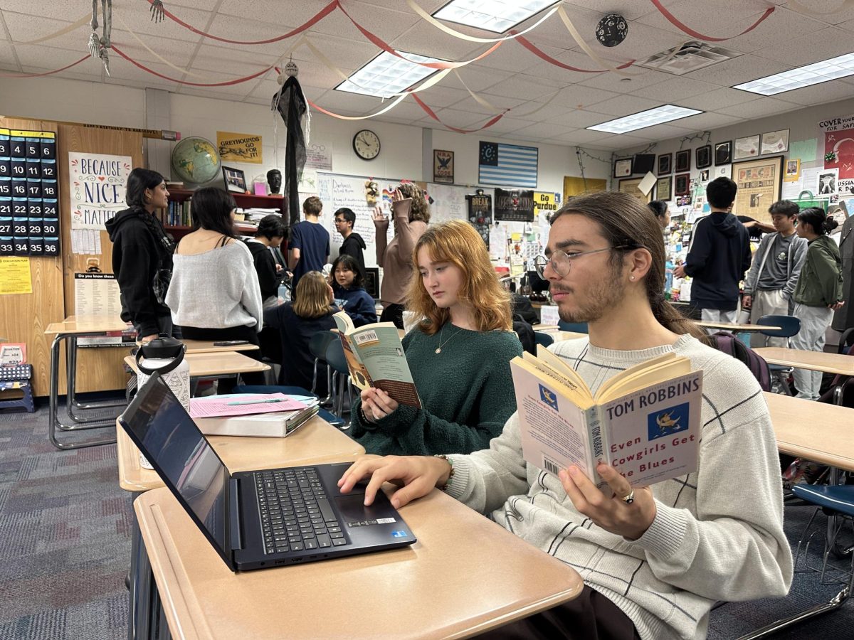 Michael Fortuna, National English Honor Society (NEHS) president and senior, works on the meeting agenda for the next meeting alongside Riley Abernathy, NEHS member and senior, on Nov. 5. “National English Honor Society is a really great group for people who love English, reading and literature. It is a great place where you can meet and bond with people with shared interests,”Abernathy said.