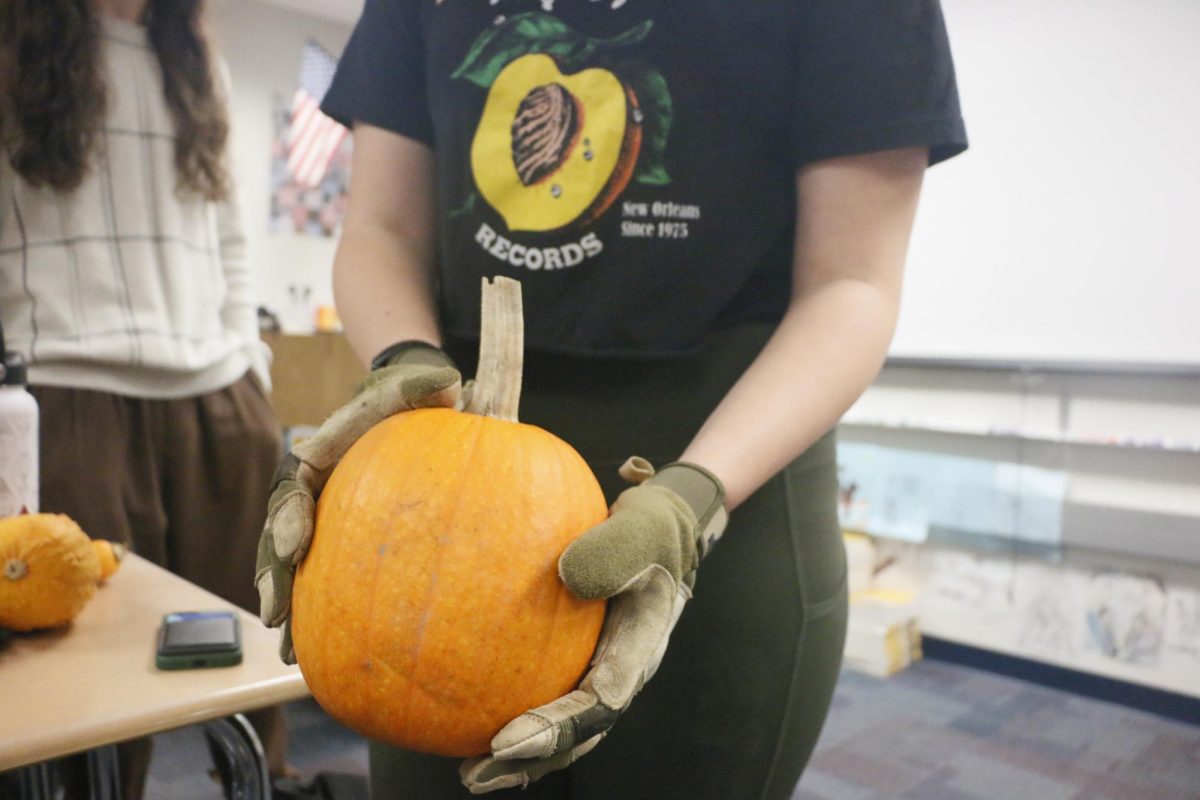 Senior Ryle Abernathy presenting local seasonal produce in class. Abernathy Farm is located in Rushville Indiana and provides an abundant amount of local produce for their community. 
