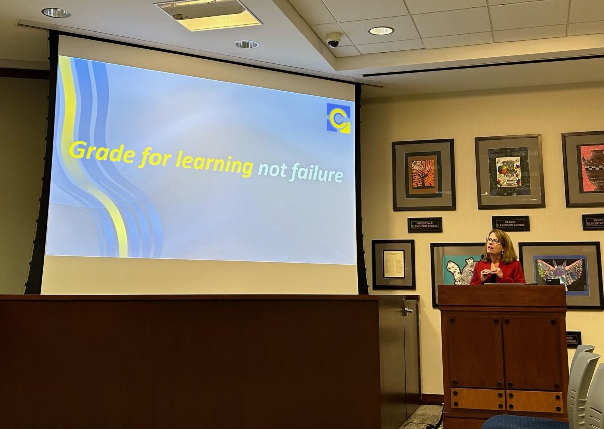 Assistant Superintendent Amy Dudley informs the school board on the CCS grading policy. Dudley said the emphases is placed on the learning of students, which allows for the acceptance of retakes and late work.