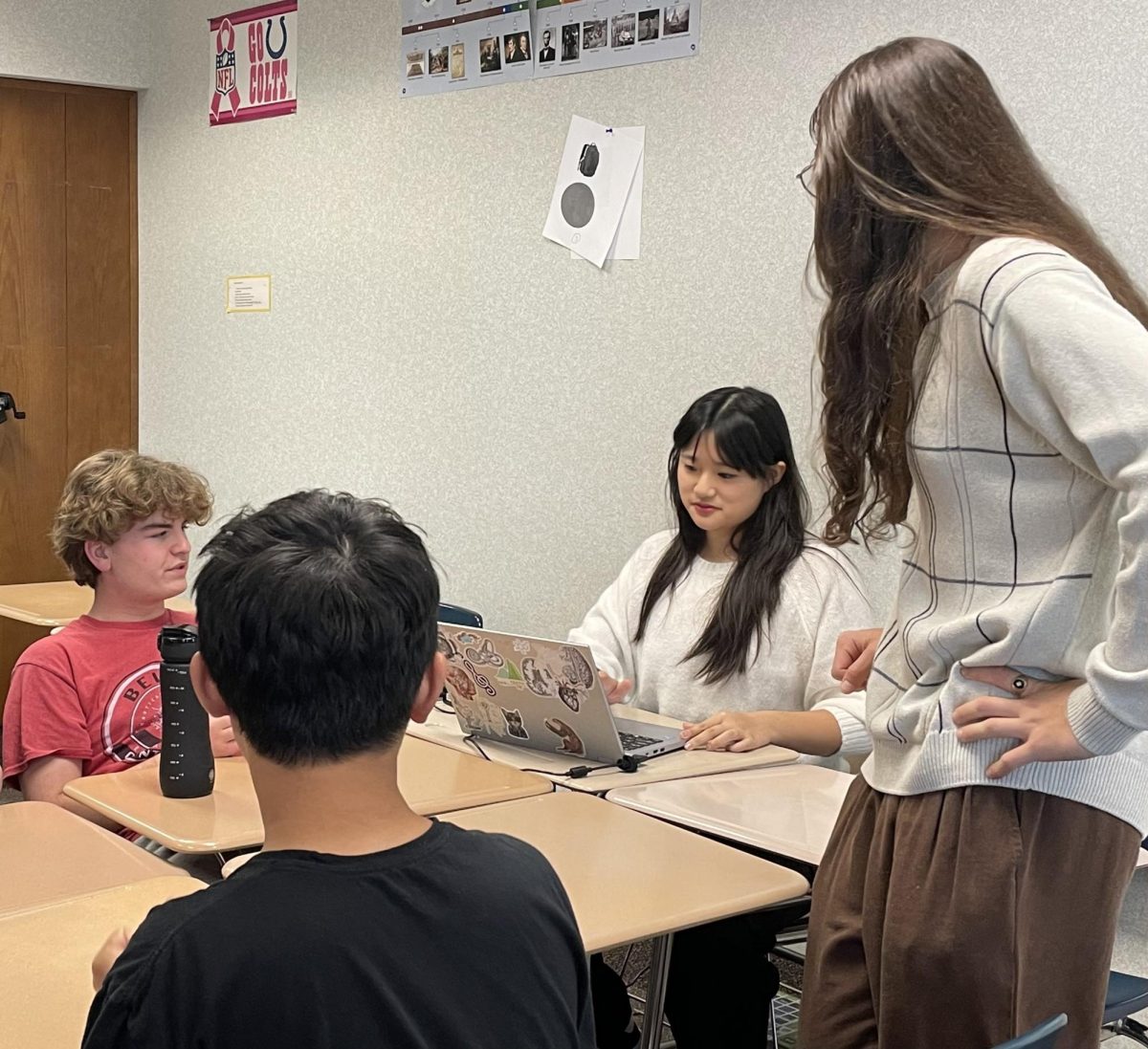 Quiz Bowl club officers discuss their plans for practice on Nov. 11. “Our main responsibility is reading (questions) for rooms during practice,” Prasad said.