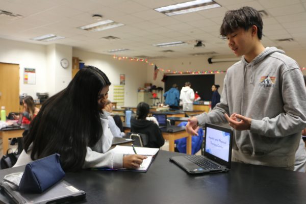 Sophomores Shambavi Muralidaren and Alex Mi practice their presentations about Endocrinology during their G4 human body systems class on Dec. 10, 2024 in Alyssa Ament's room. They successfully completed their practice and continued to review for the assessment. “We’ve been in the rigorous process of preparing our final slides presentation, I think we’ll do good,” Mi said.