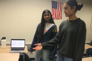 Sophomores Shreya Kumar and Vaishu Parnasala practice their team multimedia presentation (TMP) for AP Seminar during class. Kumar said, “In AP Seminar we spend a lot of time on research. Most of class is spent on work time for our upcoming research papers.”