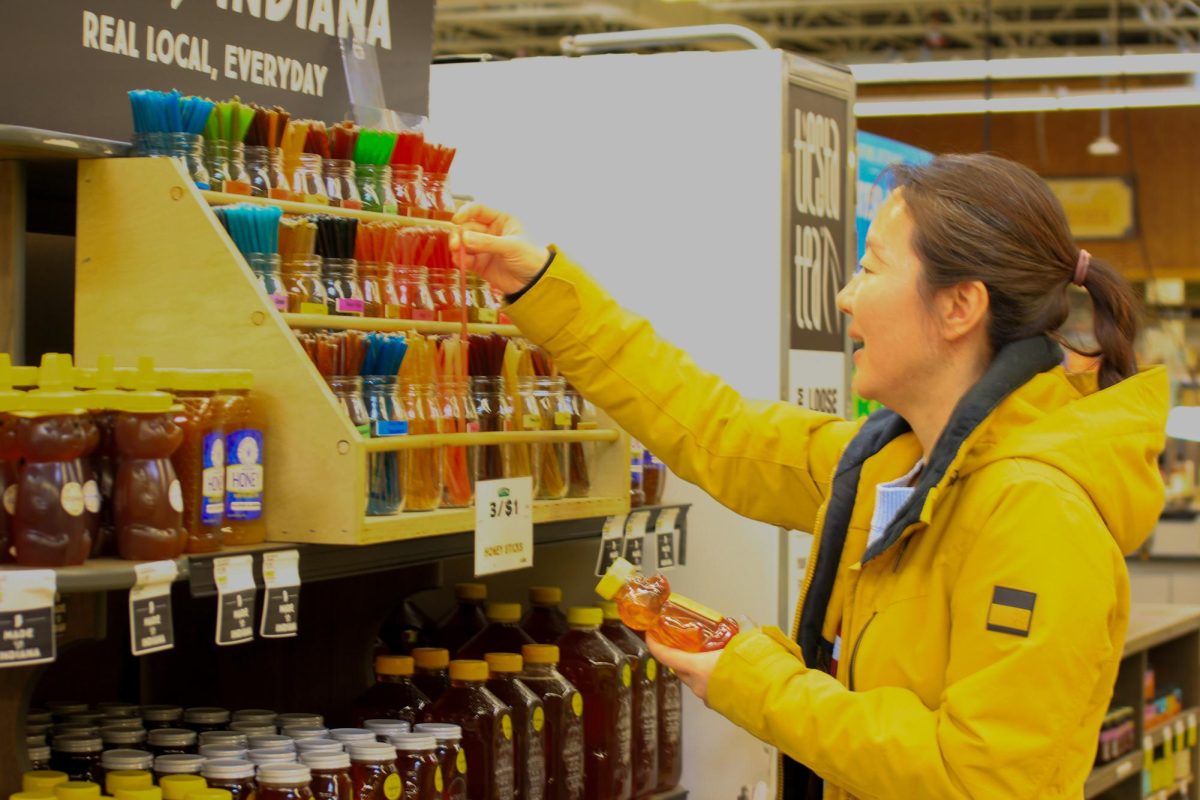 A woman buys honey at her local supermarket. Asad said, “Understanding the bees might seem like a small issue, but it can really tell us how the world and the ecosystem near us exist."