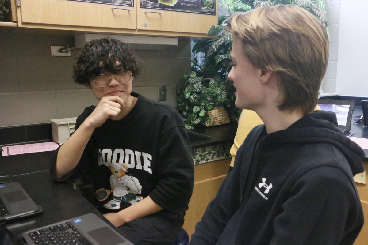 Freshmen Phillip Shin and Benjamin Holcomb work together for their genetic counseling project during biology class on Jan. 30. The pair was assigned to research breast cancer as part of a role-play scenario designed to simulate counseling an individual with disease. “Working on this project has made me realize the reality of breast cancer. And it has made me more aware of the habits that I make that might affect my health in the long-term.” Phillip said.