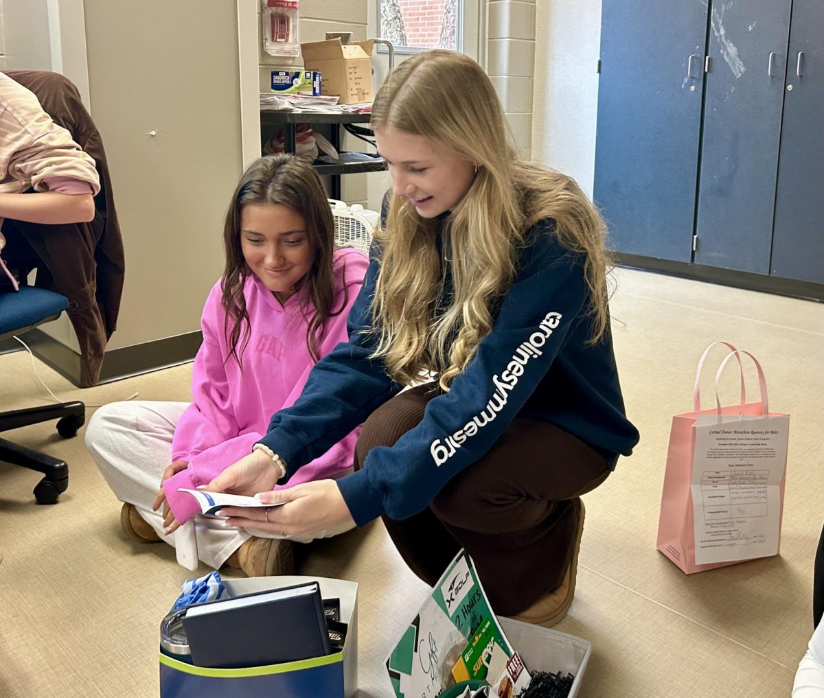 Speaker of the House and senior, Claire Wolfgang, organizes baskets on Nov. 18 in preparation for the silent auction at Runway for Riley. Wolfgang said the Cabinet compiled valuable items that will be up for bid at the event on Nov. 22. 