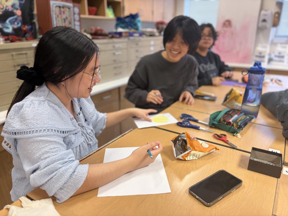 Senior Hannah Tran and Angela Yu, club officer and junior, participate in Artist’s Association’s activity on March 3. Tran and Yu created colored pencil fruit drawings for the activity. Yu said, “I hope people can learn to make art through fun challenges like these.”