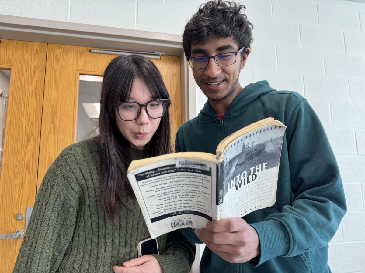 Sophomores Ashwin Krishnan and Amelia Riegel discuss a select passage in a book they had recently discovered. Since he was young, Krishnan enjoyed a variety of 19th and 20th century literature including the Lord of the Rings series.