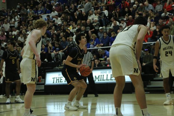 Junior Vincent Nover (11) looks looks to shoot a free throw during the sectional semifinal on March 6. The Greyhounds defeated the Millers 44-30 to advance to the sectional championship game.
