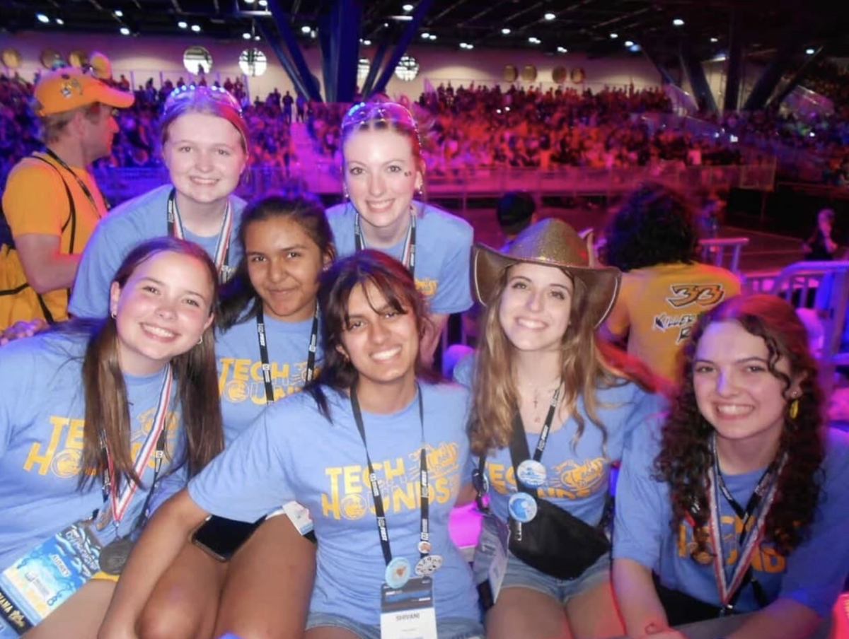 TechHOUNDS vice president and junior Emma Langlais poses with other club members at the 2025 world competition. According to Langlais, female representation in STEM is crucial. (Submitted: Emma Langlais)  