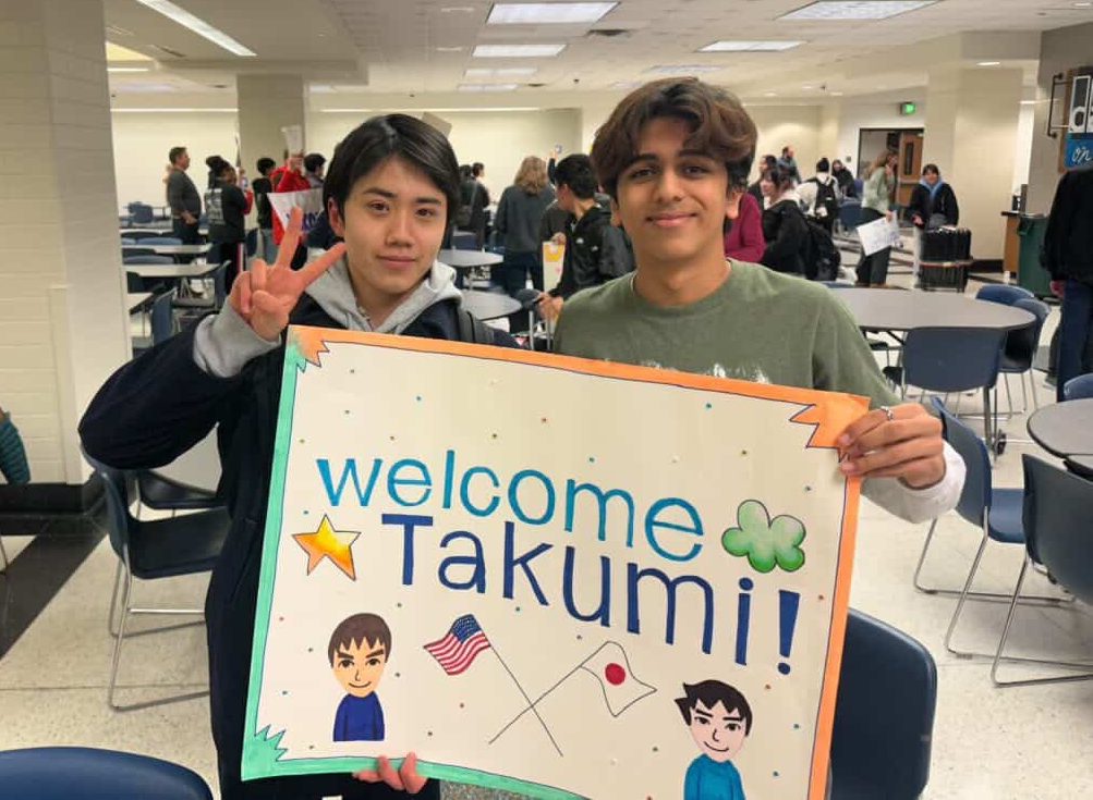 Exchange student Takumi Michibata (left) and senior Ismail Kheiri (right) greet each other during the first day of the exchange program in the main cafeteria on March 17. Michibata took part in the exchange program where the cities of Carmel and Seikyo send students every other year. (Submitted: Ismail Kheiri)