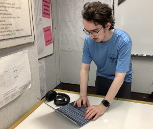 Blake Surfleet, TEDx Club president and senior, is working on his computer on April 17 to see how the videos went for the conference and what to tell the next leadership to improve on for next year. Surfleet said, “Instagram page will transition over to the new leadership.” 