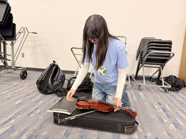 Amelia Riegel, violin player and sophomore, prepares for class. “The understanding of the music is going well,” Riegel said, “like being able to feel what the music is actually supposed to feel like.”